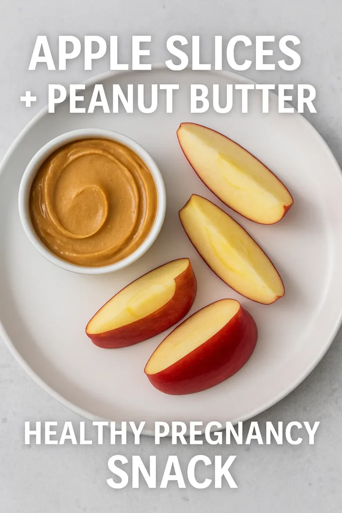 Apple slices served with creamy peanut butter as a healthy pregnancy snack