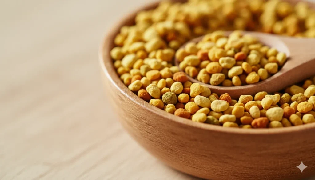 Bee pollen smoothie
Close-up photo of natural bee pollen granules in a wooden bowl.